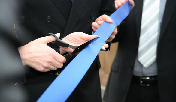 Person Cutting a Ribbon